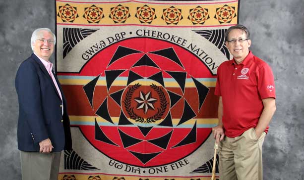 Principal Chief Bill John Baker and blanket designer Dan Mink stand with the Cherokee Nation’s newest Pendleton Blanket, now on sale at Cherokee gift shops.