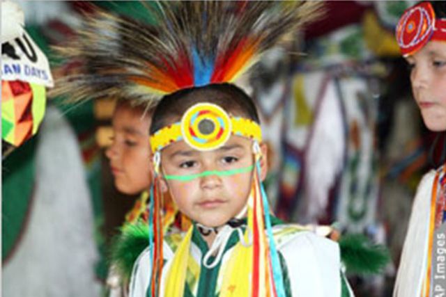 Photo: Boy in tribal clothing/ AP