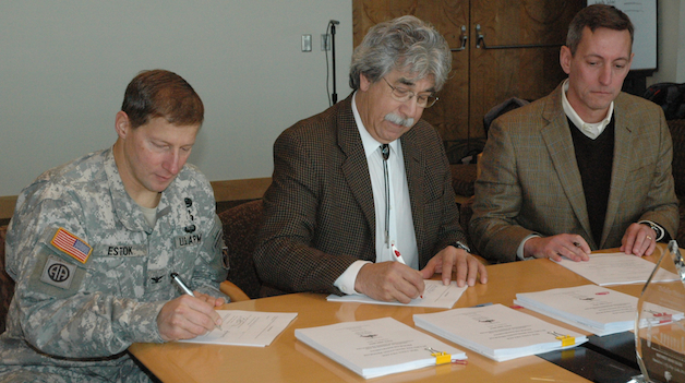Col. Bruce Estok, district commander and engineer of the U.S. Army Corps of Engineers' Seattle District, joins Tulalip Tribal Chair Mel Sheldon Jr. and David Allnutt — director of the Office of Ecosystems, Tribal and Public Affairs for Region 10 of the Environmental Protection Agency — in signing the first Native American In-Lieu Fee Program in the nation for Quil Ceda Village on Nov. 26.— image credit: Kirk Boxleitner
