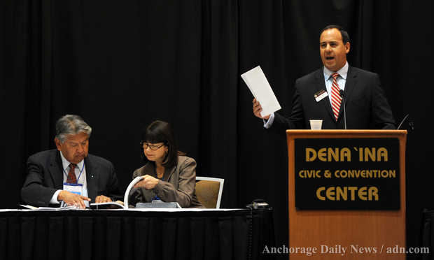 Chair Troy Eid, right, addresses the audience as fellow commissioners Ted Quasula, left, and Carole Goldberg of the Indian Law and Order Commission review a section of their report at the 23rd Annual BIA Tribal Providers Conference on Wednesday, December 4, 2013, at the Dena'ina Civic and Convention Center. ERIK HILL — Anchorage Daily New