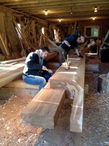 Eric Hammer (front) and Harley Bell-Holter work in Kasaan’s carving shed. (Courtesy Organized Village of Kasaan)