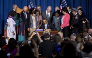 President Obama, joined by Vice President Biden, members of women’s organizations, law enforcement officials, tribal leaders, survivors, advocates and members of Congress, signs the Violence Against Women Act in March. (Manuel Balce Ceneta/Associated Press) 