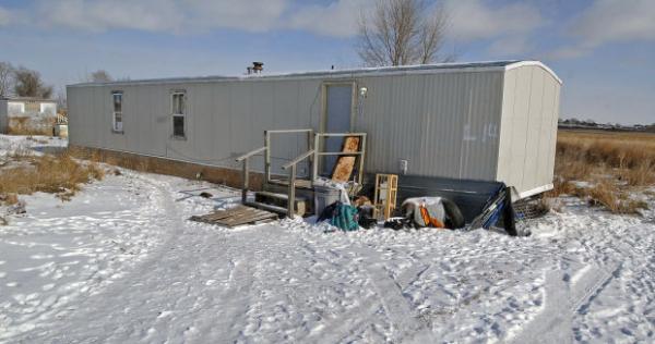 AP Photo/The Bismarck Tribune, Tom StrommeThis Wednesday, Feb. 5, 2014 photo shows the Fort Yates, North Dakota mobile home where Debbie Dogskin was found dead Tuesday morning with an empty propane tank.