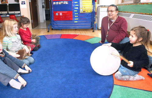 Shannon O’Nabigon beats a rhythm on the drum as she and other children sing “Weya Heya,” an Ojibwe counting song, in the Ojibwe Language Nest at the University of Minnesota Duluth in 2009. Teacher Gordon Jourdain is at right. From left are George Petersen, Eleanor Ness and Grace Russell. The Duluth school district will vote Tuesday on whether to add a kindergarten Ojibwe immersion class at one of the district’s elementary schools. (File / News Tribune)