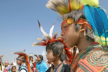 AP Photo/Yakima Herald-Republic, Gordon KingYoung men wait to take part in an annual pow wow and rodeo in Toppenish, Wash. The boys are members of the Coleville and Yakama tribes.