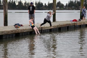 Melody Hatch braves the cold waters of Tulalip Bay to complete her 2014 Winter Challenge.Photo/ Mike Sarich, Tulalip TV