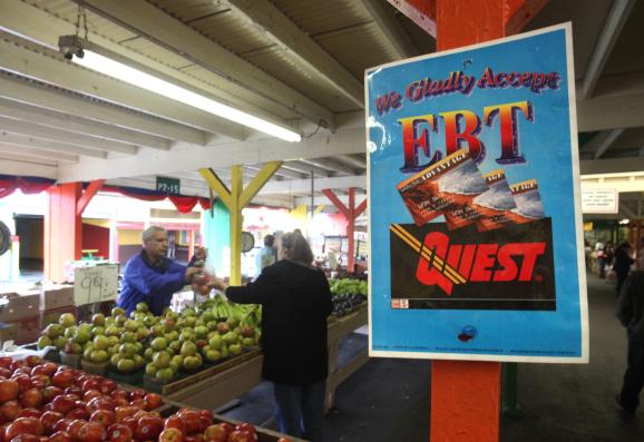 In this photo taken Saturday, Feb. 6, 2010, a sign announcing the acceptance of electronic Benefit Transfer cards is seen at a farmers market in Roseville, Calif.Credit Rich Pedroncelli / AP Photo