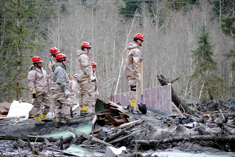 Rescue workers are combing the site of a massive landslide near Oso, Wash. Maj. Tawny Dotson Washington National Guard 