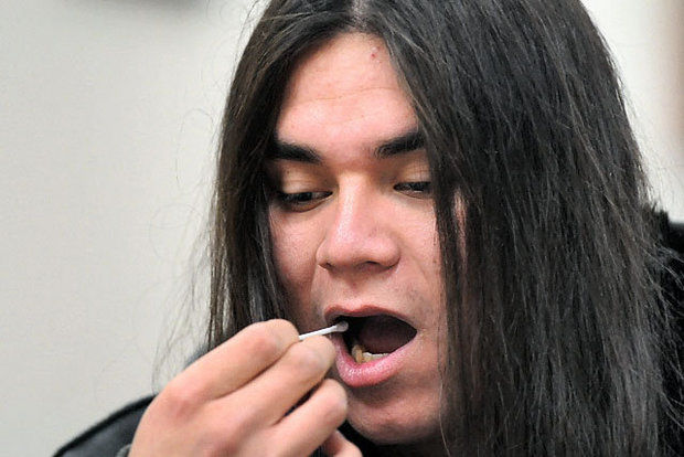 Christopher Murillo, 20, of Eastwood swabs the inside of his mouth during the bone marrow drive held at the Onondaga Nation in this 2010 file photo. The sample given by Murillo, an Onondaga, was tested to see if he was a match to be a donor for Cazenovia teen who is one-quarter Native American. Native Americans make up about one percent of the 10 million donors on the blood marrow registry. Photo: John Berry / The Post-Standard, 2010