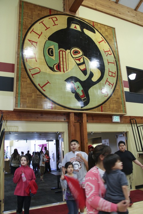 Above the new basketball court in the Don Hatch Youth Center gym hangs the former basketball middle court emblem which previously used to be where the new youth center sits. Photo/ Brandi N. Montreuil, Tulalip News