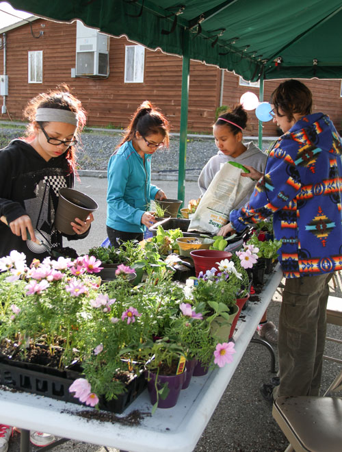 Tulalip tribal member Mandy Carter volunteered her gardening expertise to teach the girls how to plant their own vegetables and flowers during the Girls Group opening house held on April 10. Photo/ Brandi N. Montreuil, Tulalip News