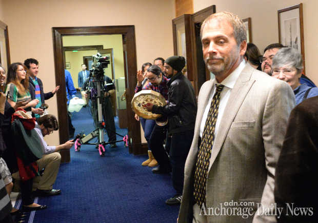 Alaska Natives beat the drum during a protest in front of Sen. Lesil McGuire's Capitol office as her chief of staff, Brett Huber, in tie, prepares to address them. The protesters wanted McGuire, R-Anchorage, the chairwoman of the Senate Rules Committee, to release the Native language bill and send it to the Senate floor. Huber told them that she would and that she supported the measure, which passed the House unanimously. RICHARD MAUER