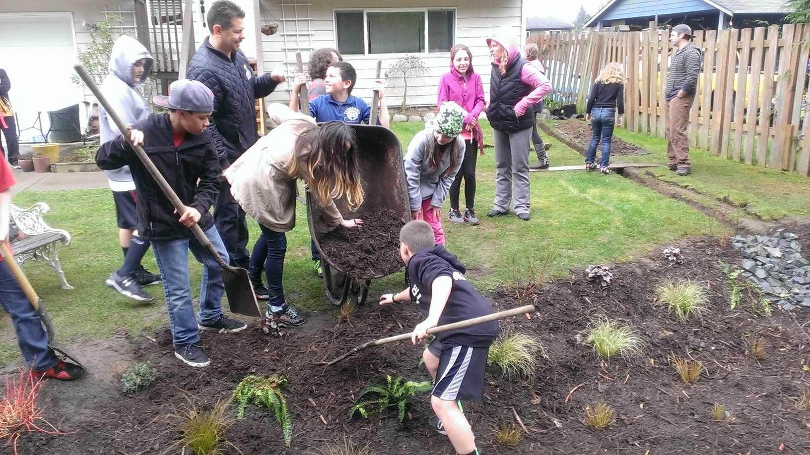Marshall Elementary students were invited to come help plant in the new rain garden. Photo by Valerie Streeter