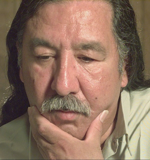 Leonard Peltier, shown here in a 1999 photo, was given two life sentences in a trial that has sparked controversy for decades. (Joe Ledford / Associated Press)