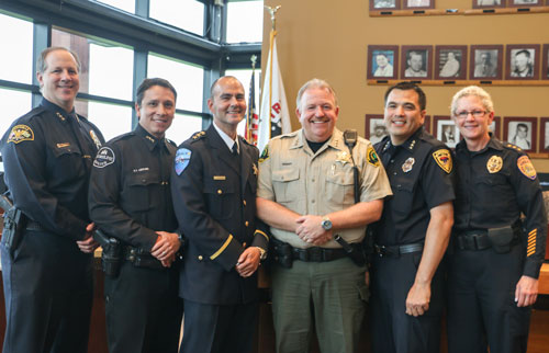 Tulalip Police Chief Carlos Echevarria is joined by (left to right) Marysville Police Chief Rick Smith, Shoreline Police Chief Shawn Ledford, Snohomish County Sheriff Ty Trenary, Lake Stevens Interim Police Chief Dan Lorentzen, and Everett Police Chief Kathy Atwood. All who attended Chief Echevarria's swearing in ceremony on May 7. Photo/ Brandi N. Montreuil, Tulalip News