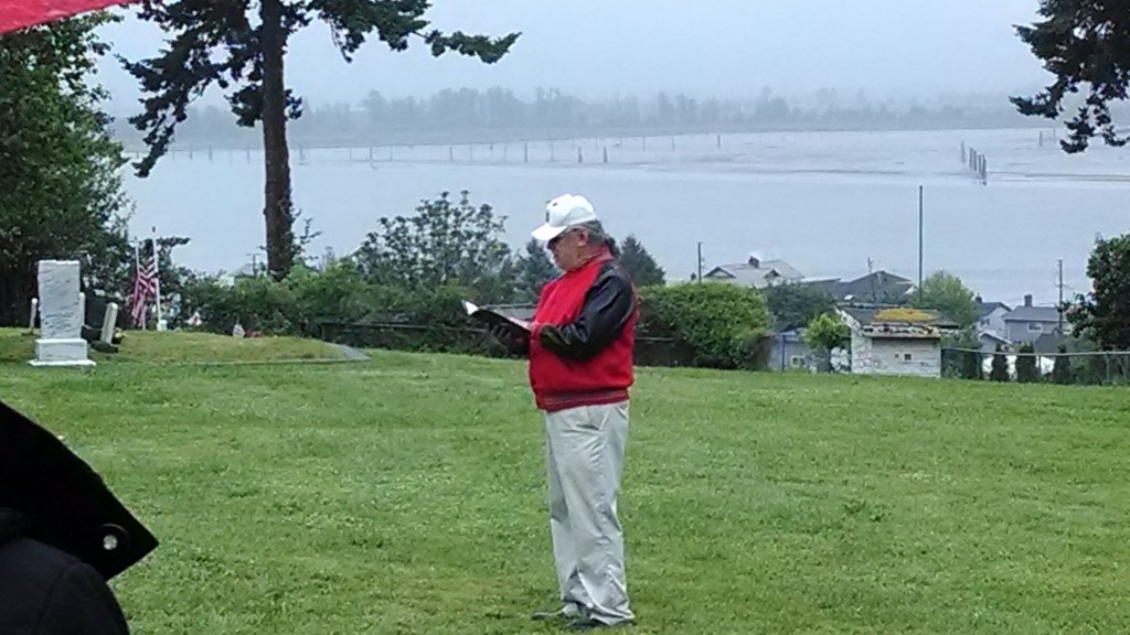 Tulalip Veteran Cy Hatch Jr. calls the roll at Priest Point Cemetery. Photo: Andrew Gobin/Tulalip News