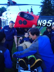 Tulalip Firefighter Nikolay Litvinchuk being loaded into a Med-Evac chopper  Photo: Andrew Gobin/Tulalip News
