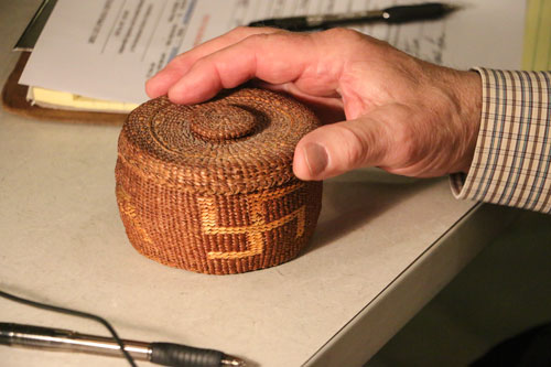 A basket featuring the "rolling logs" pattern, which is sometimes confused with a swastika, was brought in by Bothell resident, Jim Freese to the May 3, Hibulb Appraisal Day. The unique weaving and emblem was considered good luck and used in the early 1900s. The basket was appraised at $125- $175. Photo/ Brandi N. Montreuil, Tulalip News 