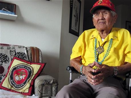 FILE - This Nov. 29, 2009, file photo, shows Chester Nez talking about his time as a Navajo Code Talker in World War II at his home in Albuquerque, N.M. Nez, the last of the 29 Navajos who developed an unbreakable code that helped win World War II, died Wednesday morning, June 4, 2014, of kidney failure at his home in Albuquerque. He was 93. (AP Photo/Felicia Fonseca, File)