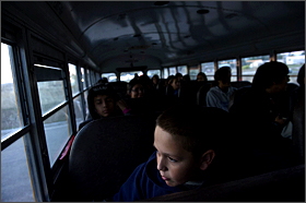 Fifth grader Manuel Tyon, 10, rides the bus to Red Cloud Indian School on South Dakota's Pine Ridge Indian Reservation on Oct. 23, 2013.—Swikar Patel/Education Week