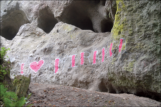 This July 25, 2014 photo shows graffiti expressing affection for someone named Miranda on the sacred Jamestown S'Klallam site of Tamanowas Rock. (AP Photo/Peninsula Daily News, Joe Smillie)