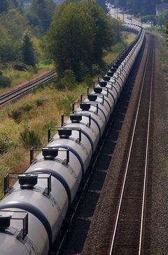 Mark Mulligan / The HeraldA train of tank cars — each bearing the placard 1267, denoting that the tank carries crude oil — waits on the tracks going through Everett recently.