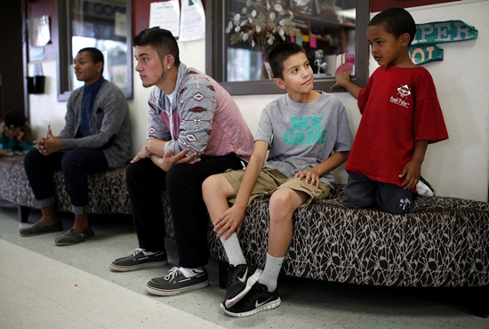 Ian Terry / The HeraldLeno Vela (center), 11, talks with JJ Gray (right), 5, at the Tulalip Boys and Girls Club.