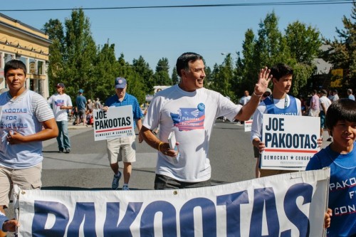 Candidate Joe Pakootas, center, walks with his family in the Perry Street Parade in Spokane, Washington July 26, 2014. Ian C. Bates for Al Jazeera America