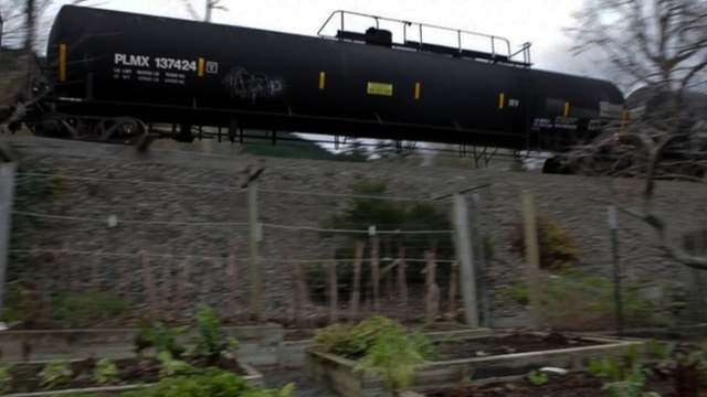 An oil train moves through Skagit County in Western Washington, headed to refineries in the Northwestern part of the state. | credit: Katie Campbell