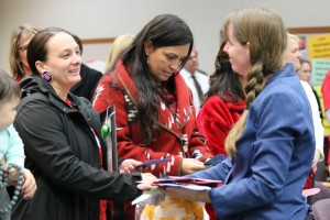 Tulalip Tribes council members Theresa Sheldon and Deborah Parker receive hand written notes from Stephanie Hope Smith from the Newtown Rotary Club, Monday, Nov. 3, 2014, at the Marysville School District Administrative offices. The notes were made by well wishers and given to the Sandy Hook Elementary School following the deaths of 26 children and adults from a 2012 shooting. (Tulalip News Photo/ Brandi N. Montreuil)