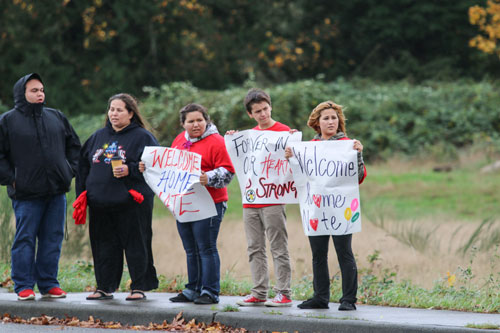 Tulalip Tribal members and Tulalip community members line the street waiting to welcome Nate Hatch home, Thursday, Nov. 6, 2014, on the Tulalip Indian Reservation. Hatch was shot in the jaw during the Oct. 24, 2014 Marysville-Pilchuck High school shooting by fellow classmate and friend Jaylen Fryberg.  (Tulalip News Photo/ Brandi N. Montreuil)