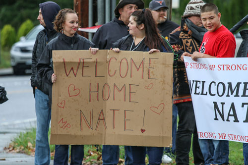 Tulalip Tribal members and Tulalip community members line the street waiting to welcome Nate Hatch home, Thursday, Nov. 6, 2014, on the Tulalip Indian Reservation. Hatch was shot in the jaw during the Oct. 24, 2014 Marysville-Pilchuck High school shooting by fellow classmate and friend Jaylen Fryberg.  (Tulalip News Photo/ Brandi N. Montreuil)