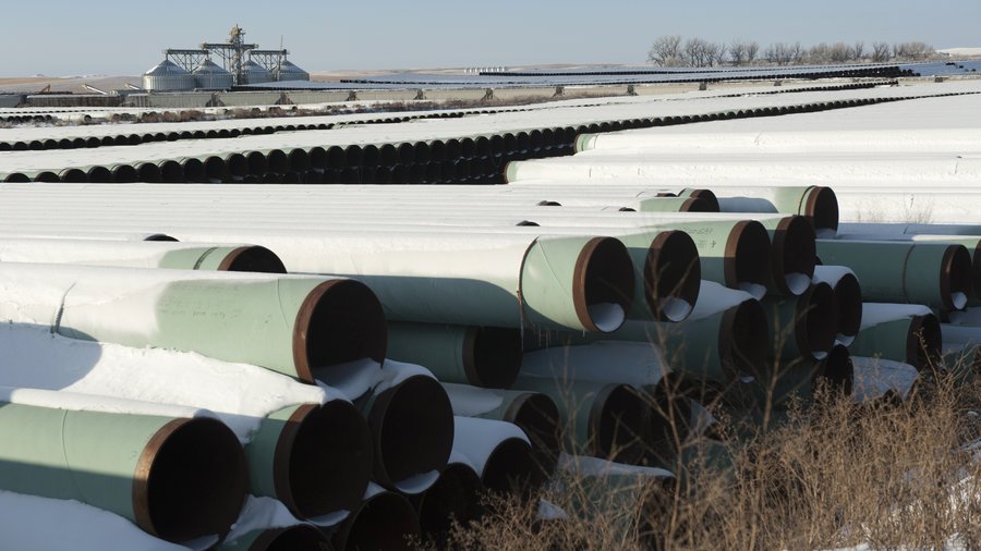 Pipes for Transcanada Corp.'s planned Keystone XL oil pipeline are stacked at a depot in Gascoyne, N.D. The House of Representatives approved the Keystone XL pipeline Friday; the Senate voted against it on Tuesday.
