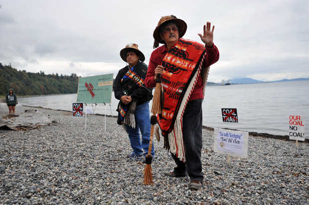 Then-Lummi Nation Chairman Clifford Cultee, left, and Hereditary Chief Bill James speak at a 2012 protest against a proposed coal export terminal at Cherry Point. The tribe sent a letter on Monday, Jan. 5, 2015 to the U.S. Army Corps of Engineers, asking the agency to reject a permit application for the coal terminal because it would interfere with tribal fishing grounds. PHILIP A. DWYER — THE BELLINGHAM HERALD