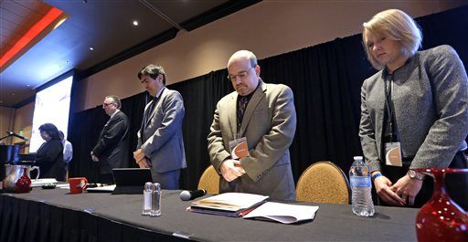 Speakers, from right, Hilary Bricken, Douglas Berman, Salvador Mungia and Robert Odawi Porter bow their heads during an opening prayer at a tribal marijuana conference for tribal governments considering whether to legalize marijuana for medicinal, agricultural, or recreational use, Friday, Feb. 27, 2015, in Tulalip, Wash. Representatives of 75 American Indian tribes from 35 states gathered to discuss what might be the next big financial boon on reservations across the country: marijuana. Tribes have been exploring the idea of getting into the pot business since the Obama administration announced in December it wouldn't stand in their way. (AP Photo/Elaine Thompson)    