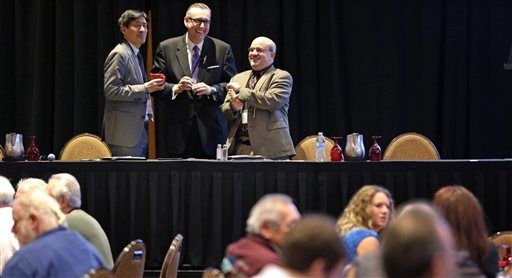 Speakers Salvador Mungia, left, Robert Odawi Porter and Douglas Berman prepare to speak at a tribal marijuana conference for tribal governments considering whether to legalize marijuana for medicinal, agricultural, or recreational use, Friday, Feb. 27, 2015, in Tulalip, Wash. Representatives of 75 American Indian tribes from 35 states gathered to discuss what might be the next big financial boon on reservations across the country: marijuana. Tribes have been exploring the idea of getting into the pot business since the Obama administration announced in December it wouldn't stand in their way. (AP Photo/Elaine Thompson)