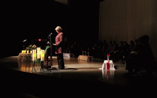 Marysville School District Superintendent Dr Becky Berg lists schools and communities around the globe who have experienced the same tragedy. A moment of silence was held for each one during an interfaith prayer service, Tuesday, Feb. 24,2015, in Marysville, WA. (Tulalip News/ Brandi N. Montreuil)