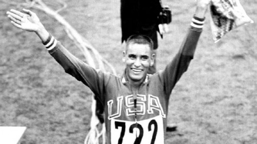 His dark early days could not overshadow the joy of Billy Mills' Olympic triumph in 1964. (AP Photo)