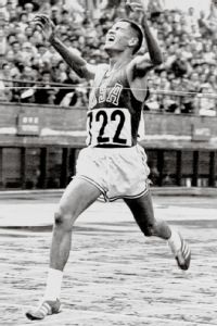 Even after crossing the finish line, Billy Mills was unsure he'd actually won the race. (AP Photo)