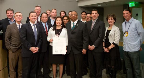 Courtesy kingcounty.govCouncilmembers are joined by representatives of the region’s Indigenous Communities as the Council declared Feb. 7, 2015 “Native American Expulsion Remembrance Day.” Claudia Kauffman, Intergovernmental Affairs with the Muckleshoot Indian Tribe, is holding the proclamation.