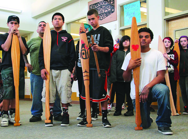 Heritage students with the paddles they made during carving class. Photo/Mara Hill