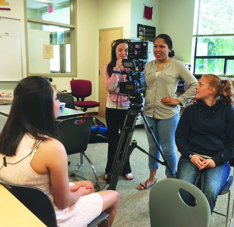 Students in the video production class get hands-on experience working with cameras and conducting interviews. Photo/Mara Hill