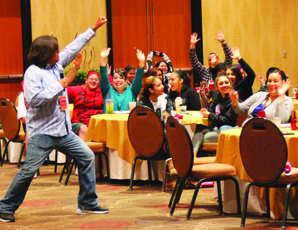 Day two keynote speaker, Vaughn Eaglebear, gets the crowd going with his comedic antics.  Photo/Micheal Rios