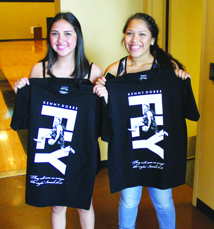 Myrna Red Leaf and Aliyah Jones show off their free Kenny Dobbs t-shirts they received for attending the event. Photo/Micheal Rios