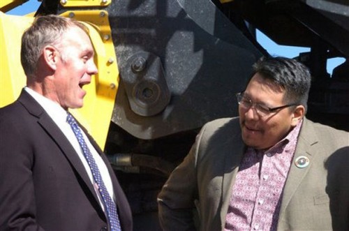 U.S. Rep. Ryan Zinke, left, laughs with Darrin Old Coyote, chairman of Montana’s Crow Tribe, during Thursday’s announcement in Billings of a proposal to make permanent a tax break for coal mined from reserves owned by American Indian tribes. Westmoreland Coal Company produced 6.5 million tons of coal last year from the Absaloka mine on the Crow’s southeastern Montana reservation. Photo/ AP