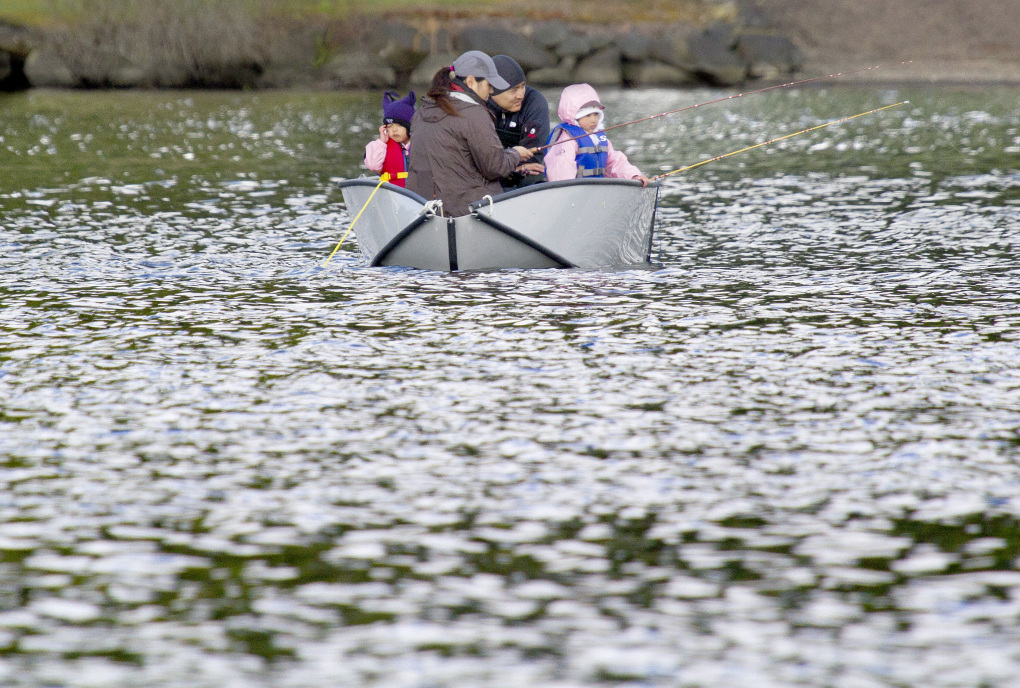 The Sugawara family from Mill Creek fish at Cottage Lake in Woodinville in 2014. (Mike Siegel/The Seattle Times)