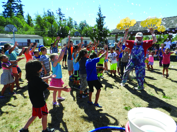 Bubbleman, Gary Golightly, performs his soap bubbles routine to the delight of the kids.Photo/Micheal Rios