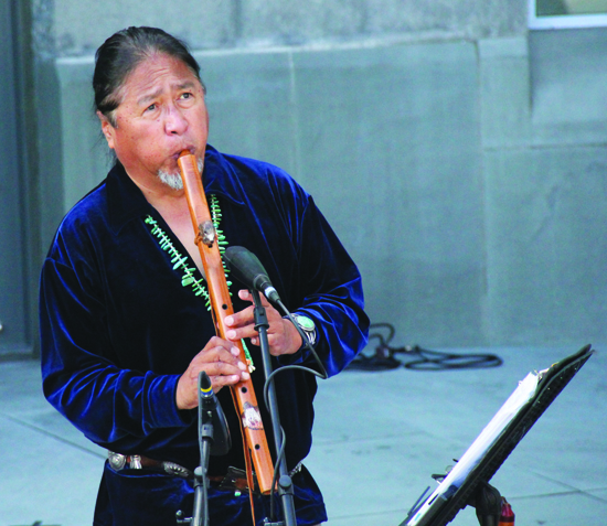Vince Redhouse (Navajo) shares his unique Native flute music with museum patrons.Photo/Micheal Rios 