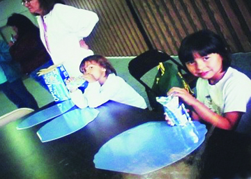 Maria Martin enjoys juice time at the first language camp, held in 1996.