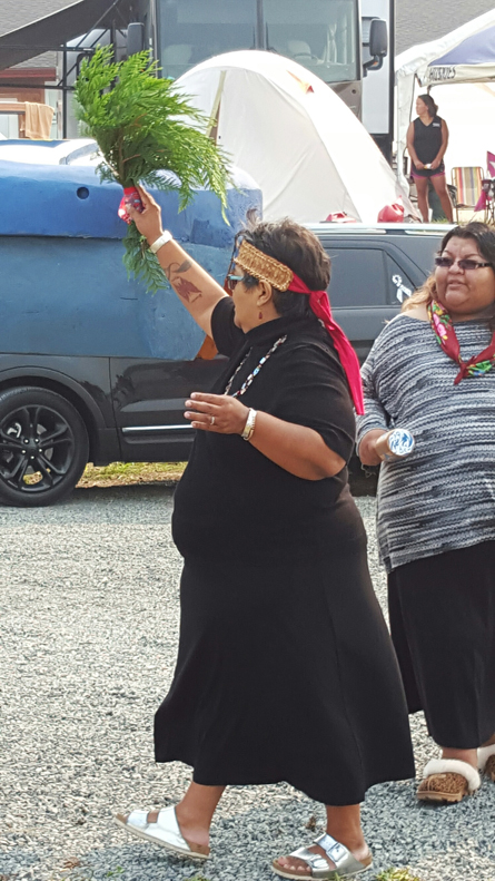Tulalip tribal member Caroline Moses blesses the totem pole. Photo/Kim Kalliber
